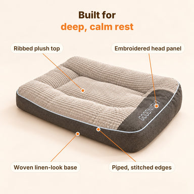 Ivalory dog bed features: ribbed plush top, embroidered head panel, piped edges, woven base