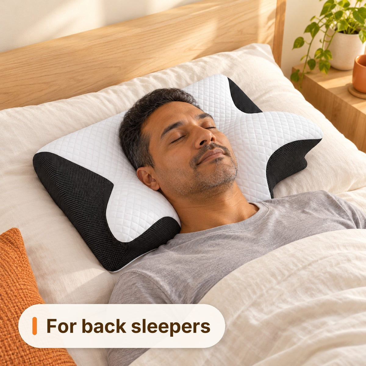 Man sleeping on his back on the Ivalory Contour Relief Pillow